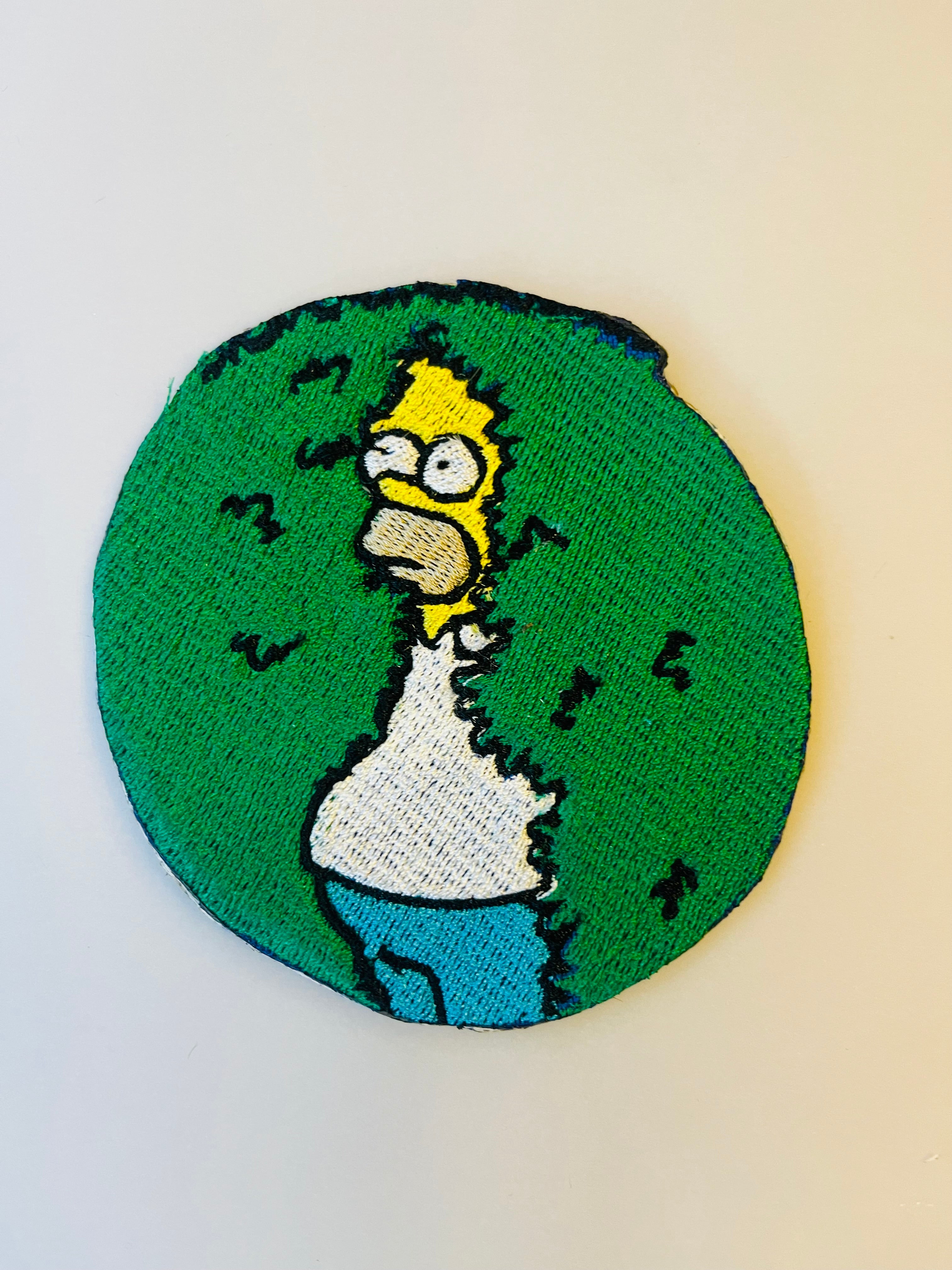 Homer in the shrubs iron-on embroidered patch
